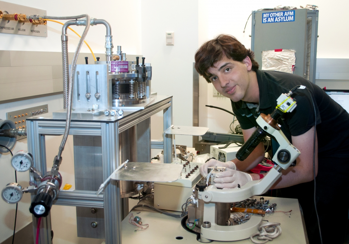 Alexandre Gauthier handles an atomic force microscope within the laboratory of Pitt Professor Jeremy Levy. Gauthier played a major role in the redesign and assembly of this low temperature scanning probe microscope, which is used to study nanoscale systems at extreme temperature lows; such innovations by Gauthier have greatly enhanced the lab's productivity.  