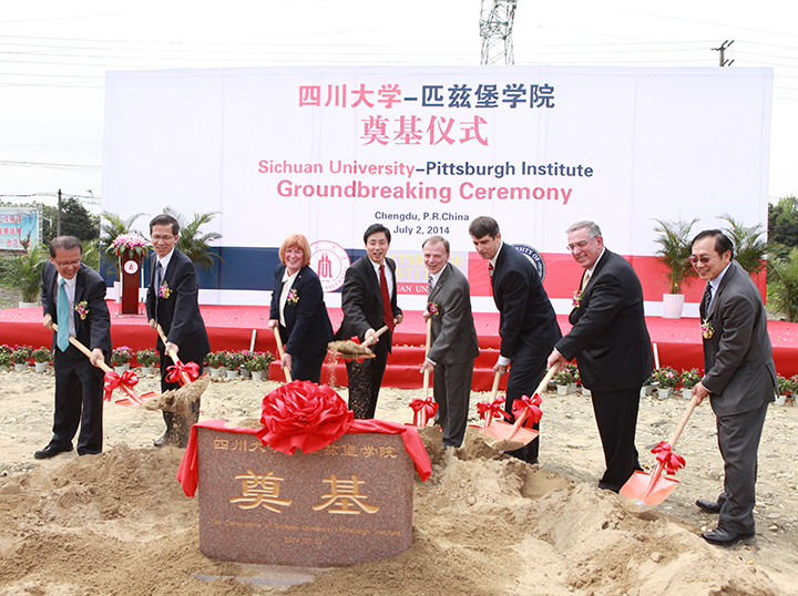 At the groundbreaking ceremony from left are Shijing Yan, vice president of international affairs at Sichuan University; Guangxian Li, executive vice president at Sichuan University; Patricia E. Beeson, provost and senior vice chancellor at Pitt; Heping Xie, president of Sichuan University; Lawrence Feick, director of Pitt's University Center for International Studies; Gregory Marcus, former consular chief at the U.S. Consulate General in Chengdu; Gerald D. Holder, the U.S. Steel Dean of Pitt's Swanson School of Engineering; and Minking Chyu, the Leighton and Mary Orr Chair Professor in Pitt's Swanson School of Engineering.
